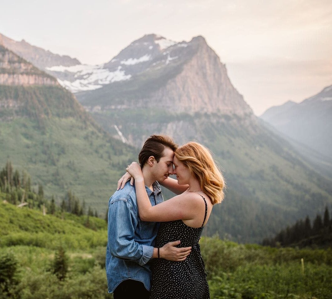 Couple touching foreheads at Big Bend in Glacier National Park, Montana.