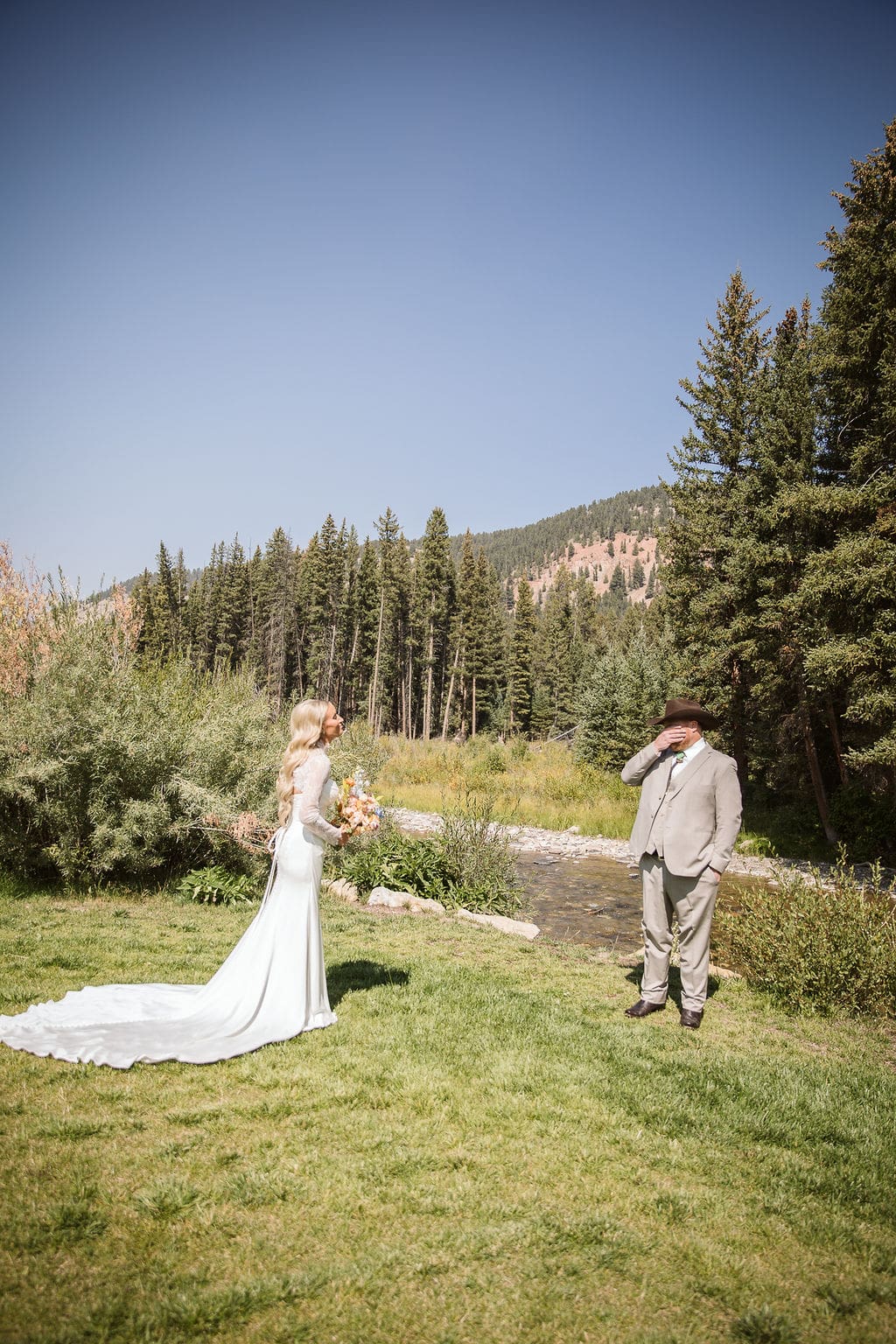 Bride and groom having a first look moment during their Bozeman wedding. 