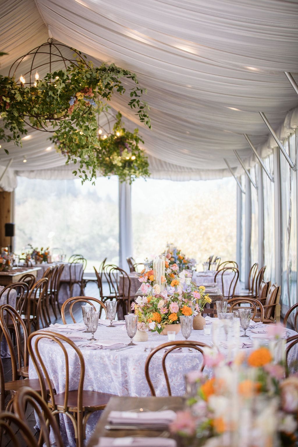Reception tent details of tables and chairs at Bozeman wedding. 