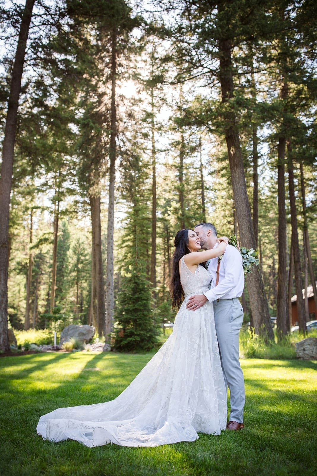 Bride and groom kissing at Kalispell wedding venue, Mountainside Weddings. 